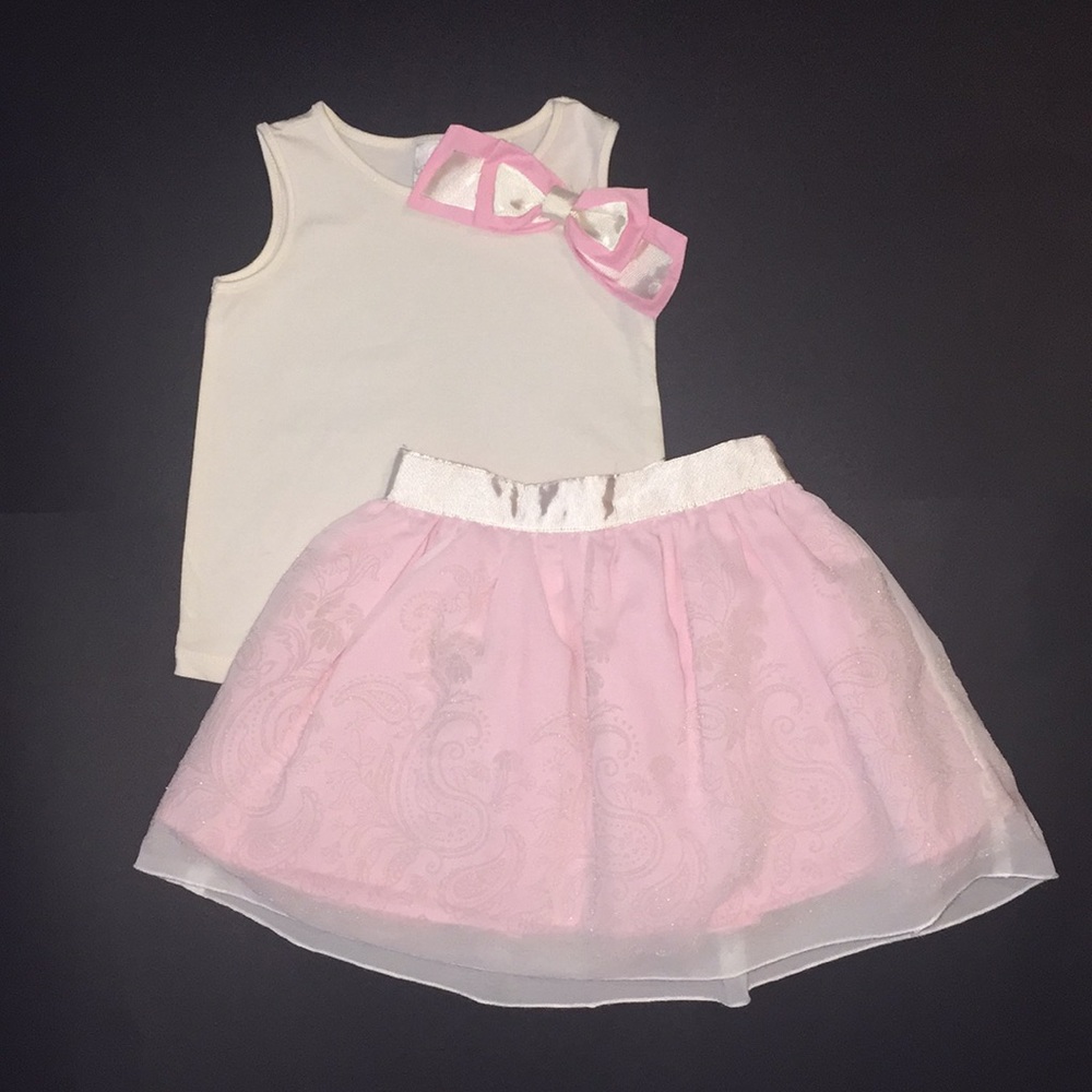 Little girls white shirt and pink skirt